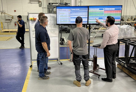 metal fabrication team working efficiently to meet production deadlines